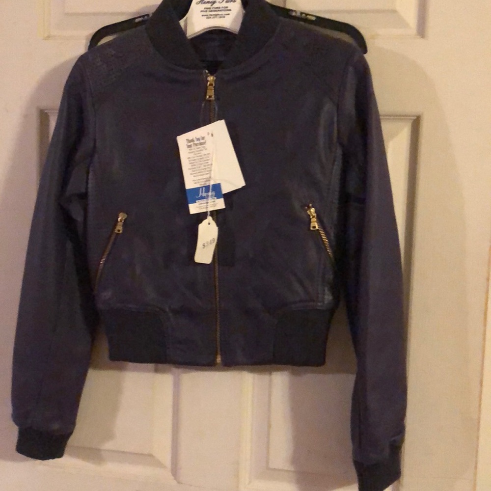 New with tags girls purple leather jacket. Size Medium. Moto style. Zip pockets